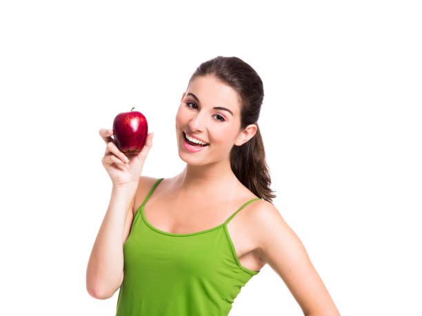 istock Healthy woman holding an apple 1398150968