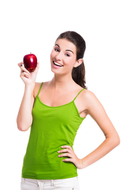 istock Healthy woman holding an apple 1398150973