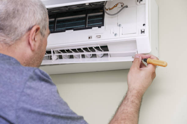istock man using screwdriver to repairing air conditioner 1398151098