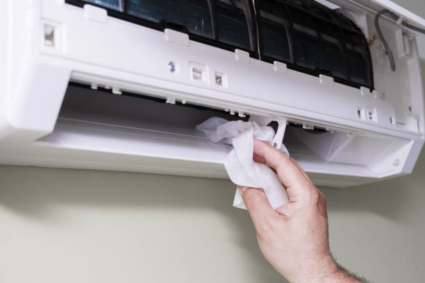 istock the master washes the home air conditioner inside with a rag 1398151116