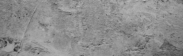 istock Panoramic concrete wall background. rock abstract wall background 1398154153