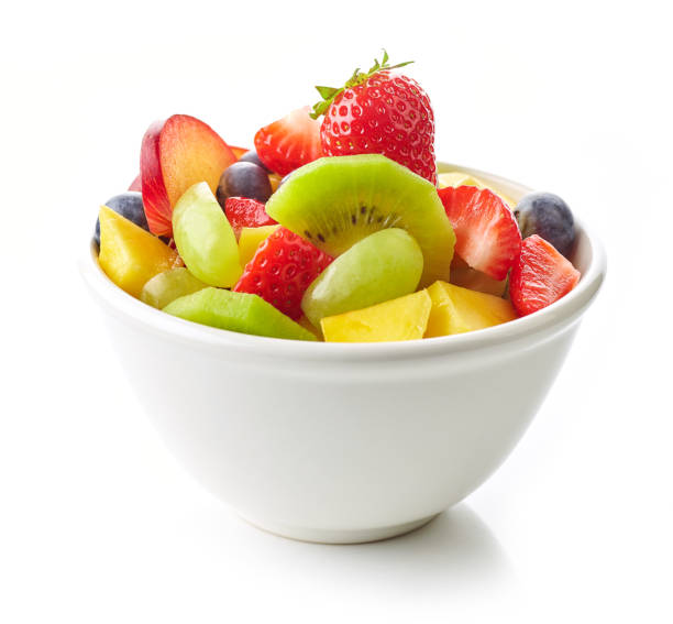 bowl of fruit salad bowl of fruit salad. fresh fruit pieces foe healthy breakfast isolated on white background fruit salad stock pictures, royalty-free photos & images