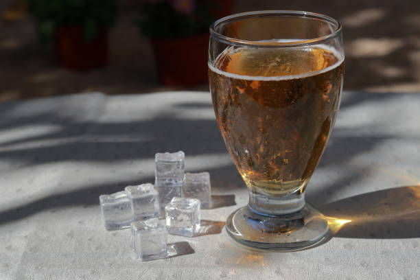 istock A glass of cold beer with ice cubes. 1398157432