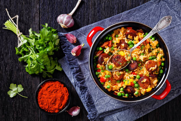 istock smoked sausages with rice and vegetables, top view 1398158971