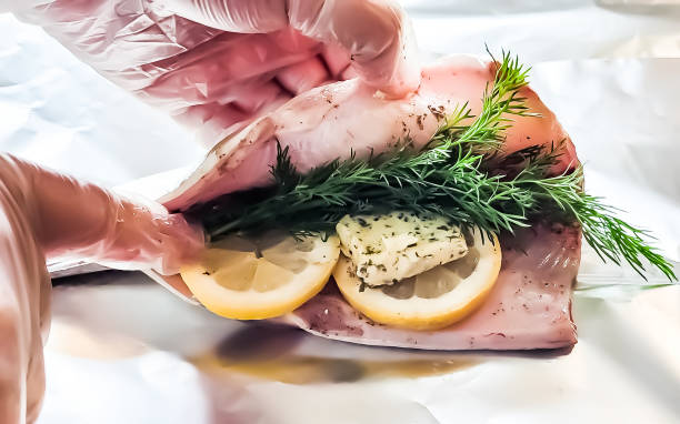 Freshly gutted trout are prepared for grilling and smoking