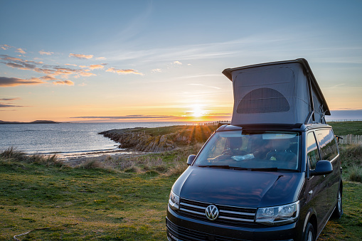 Ballyheirnan, Irealnd- May 1, 2022; VW California Ocean Campervan at Ballyherinan Beach in County Donegal, Ireland at sunset