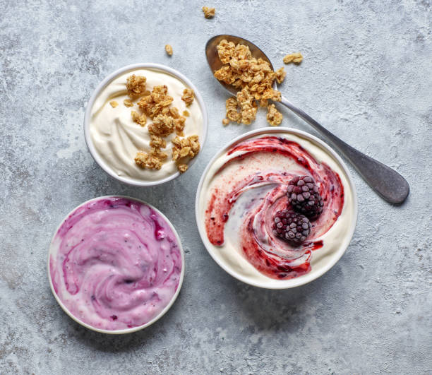 bowls of various greek yogurt bowls of various greek yogurt on kitchen table, top view yoghurt stock pictures, royalty-free photos & images