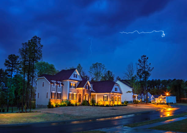 Powerful lightning storm front passes over residential houses New Hill, North Carolina, USA: April 8th 2020; Powerful lightning storm front passes over residential houses lightning rain thunderstorm storm stock pictures, royalty-free photos & images