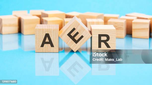 Aer Text Is Made Of Wooden Building Blocks Lying On The Bright Blue Table Concept Stock Photo - Download Image Now