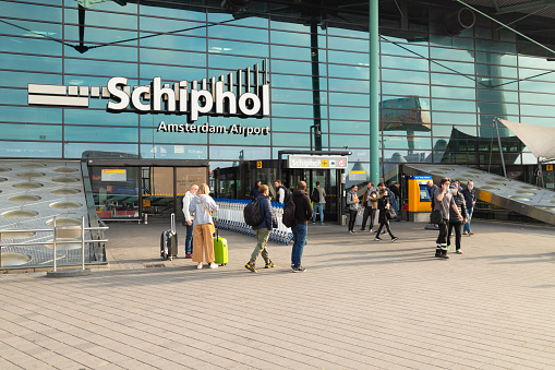 Schiphol, The Netherlands, September 22, 2021; Travelers in front of the entrance to the central hall of Schiphol airport