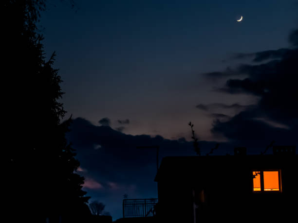 istock a sickle-shaped moon rising over a partially cloudy sky 1398176011