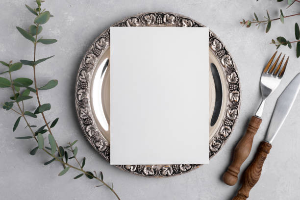 istock Wedding invitation card mockup 5x7 on silver retro vintage plate on grey background with eucalyptus, Menu card mockup 1398177662