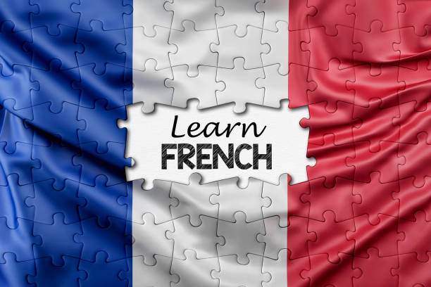 französisches lernkonzept. puzzleteile mit französischer flagge - french culture dictionary france text stock-fotos und bilder