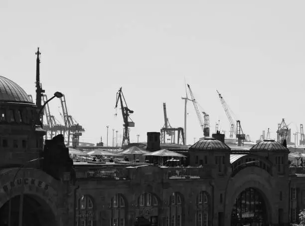 Cranes and buildings in the Hanseatic city at the harbour