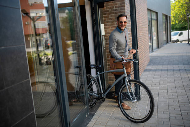 istock Young businessman going to work by his bike 1398183381