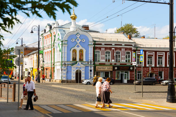 Rybinsk, Russia - August 20, 2021: Provincial cityscape with heritage of architecture in summertime, people and transport low traffic. Rybinsk city stock photo