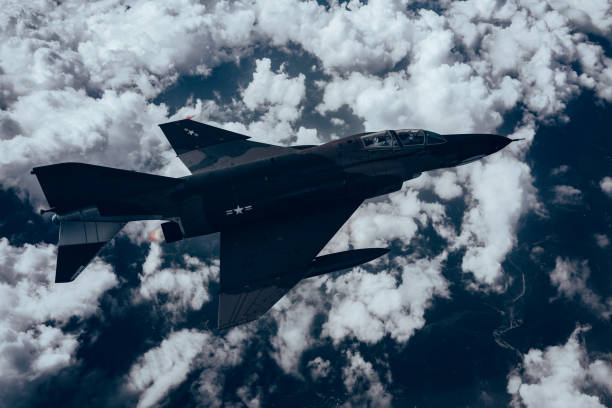istock Jet fighters flying over the clouds. 1398187359