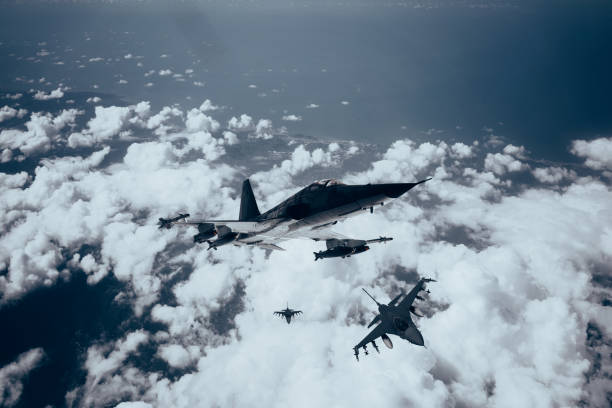 istock Jet fighters flying over the clouds. 1398187362
