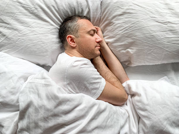 istock Middle aged man is sleeping at home 1398187448