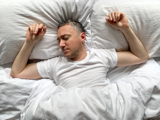 istock Middle aged man is sleeping at home 1398187459