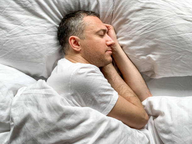 istock Middle aged man is sleeping at home 1398187470