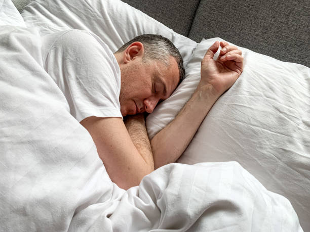 istock Middle aged man is sleeping at home 1398187482