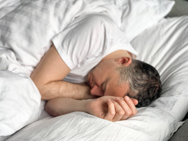 istock Middle aged man is sleeping at home 1398187484