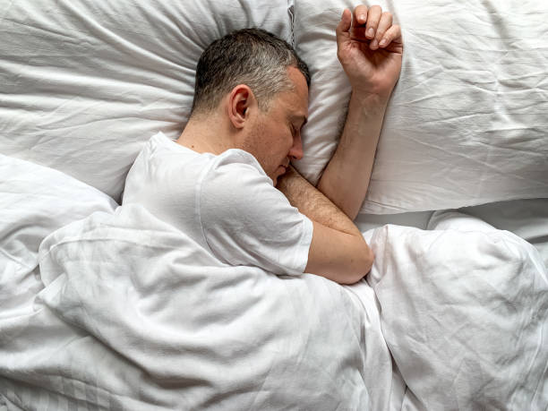 istock Middle aged man is sleeping at home 1398187489