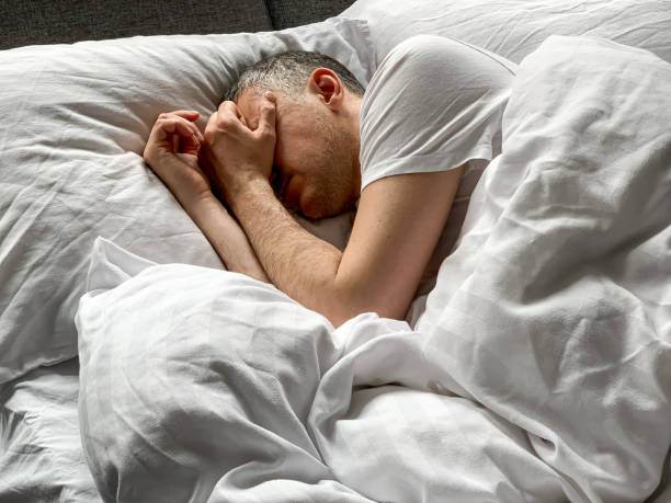 istock Middle aged man is sleeping at home 1398187494