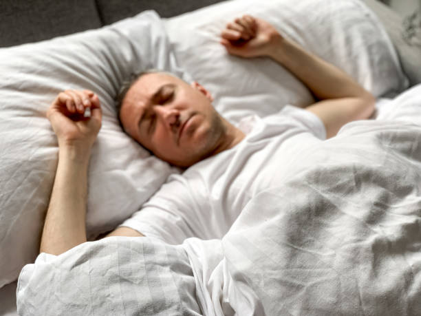 istock Middle aged man is sleeping at home 1398187505
