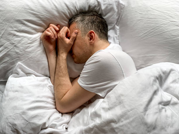 istock Middle aged man is sleeping at home 1398187516