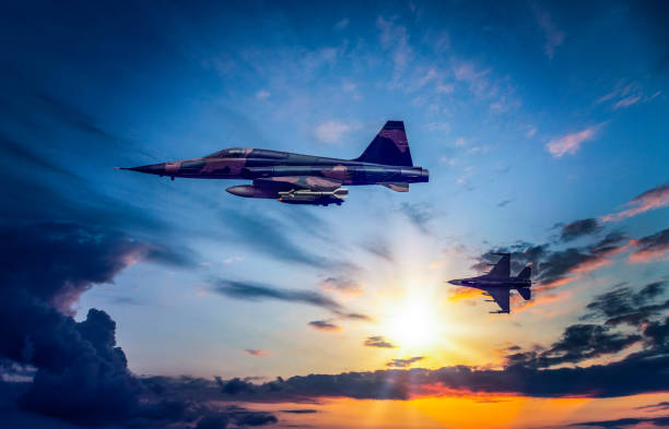 istock Jet fighters flying over the clouds. 1398189041