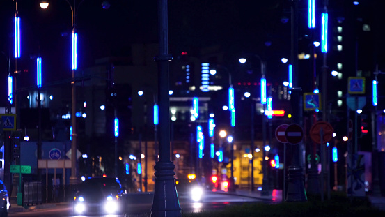 Futuristic city highway lights at night. Stock footage. Modern lighting with lanterns roads of metropolis at night. Futuristic lighting night highway creates impression of city of future.