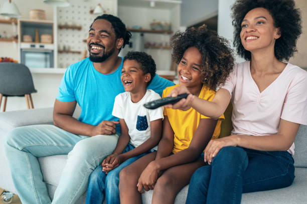 istock Family watching television 1398194516