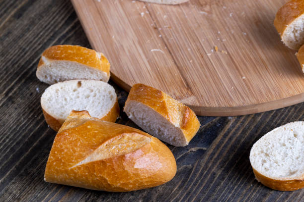 istock sliced baguette while cooking in the kitchen 1398197418
