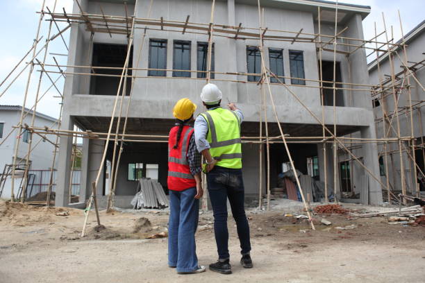 istock engineering on Construction Site. Real Estate Building Project with Civil Engineer 1398198940