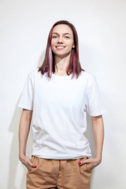 Studio portrait of 30 year old woman with purple hair stock photo