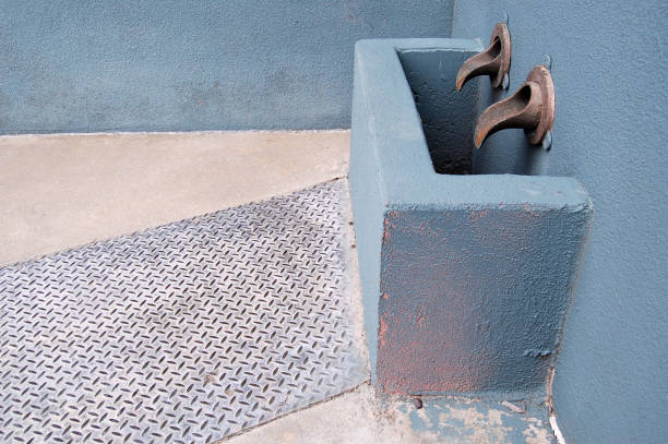 istock Metal water faucets and spillage container 1398200850