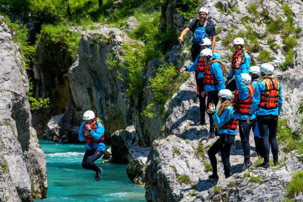 istock Jumping down into natural swimming pool in gorge 1398204225