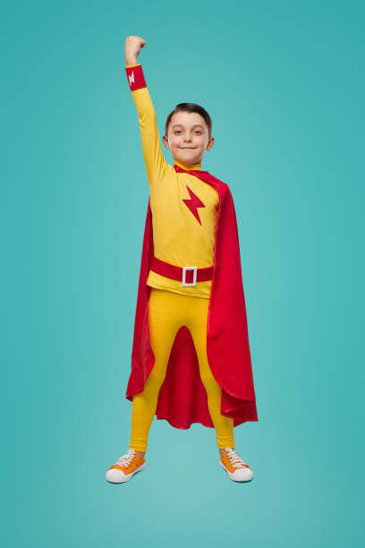 istock Brave superhero child with arm raised 1398204340