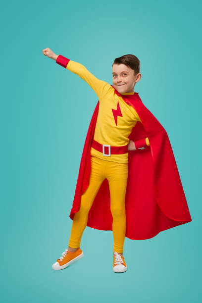 istock Proud superhero kid with arm raised 1398204354