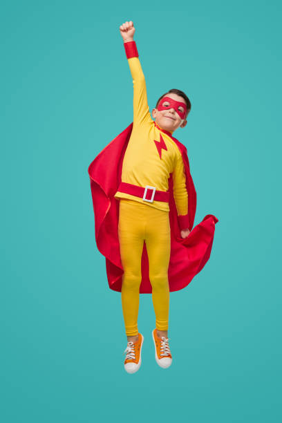 istock Brave superhero kid with arm raised 1398204381