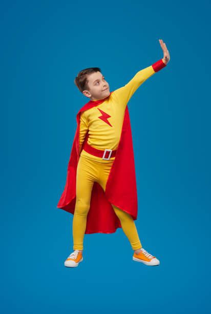 istock Superhero child showing stop gesture in studio 1398204390