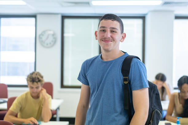 istock Confident teenage boy at school 1398206106