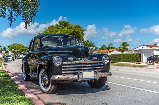 American classic black car of the 40's in the streets of Miami Beach.