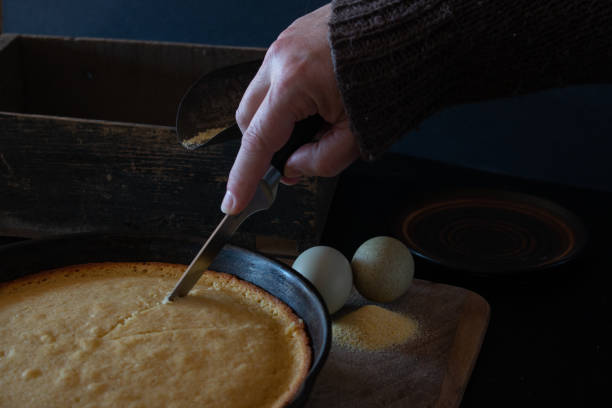istock Studio shot of a kitchen knife cutting freshly baked cornbread 1398207982