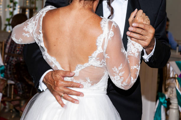 istock Married couple dancing at their wedding party 1398214573