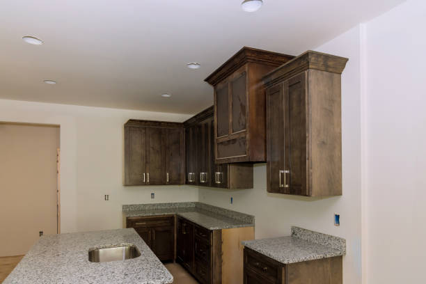 istock Kitchen furniture set installation in hanging cabinet 1398220920
