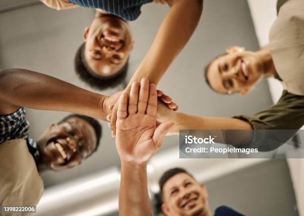 Diverse Businesspeople Hands Stacked From Below Group Of Fashion Designers Celebrating And Motivating Each Other Tailors Huddled With Hands Piled Group Of Designers Having Fun With Hands Stacked Stock Photo - Download Image Now