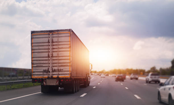 istock Car truck container transport  on road 1398223016